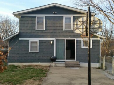 View of Back of Home with Large Patio & Basketball