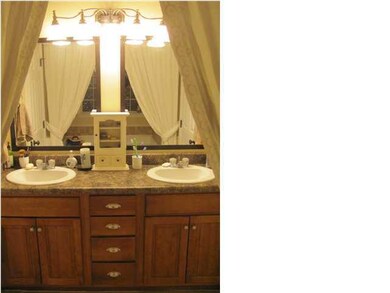 Double Vanity in Master Bath. Garden tub and separ
