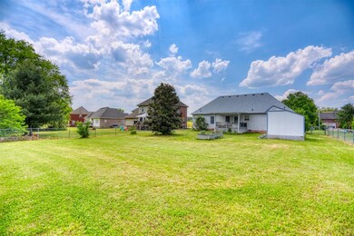 Spacious fenced in back yard with additional storage.