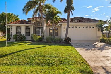 Mediterranean / spanish house with a front yard an