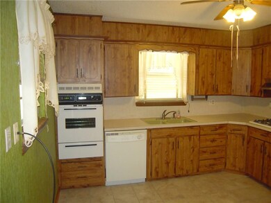 Kitchen with tile floors and gas cook top