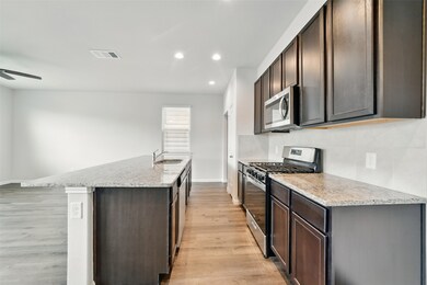 Modern appliances and gas stove top 
