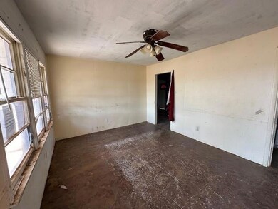 Spare room featuring ceiling fan