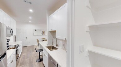 Kitchen with appliances with stainless steel finis