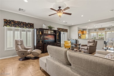 Living area with recessed lighting, plenty of natu