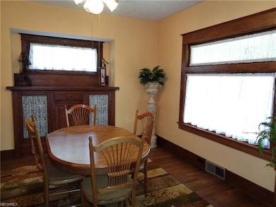 The formal dining room showcases the original oak 