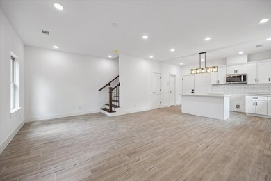 The spacious open living space has beautiful moder