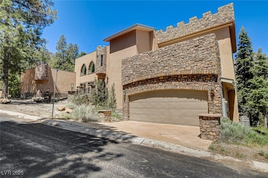 View of property featuring concrete driveway