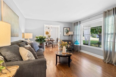 Lovely living room with a large window that boasts a beautiful view!