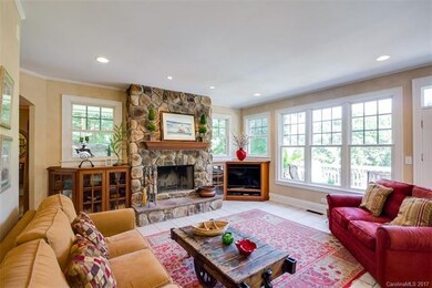 Family Room with stone fireplace, built in's.
