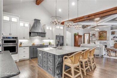The designer kitchen offers an oversized island wi