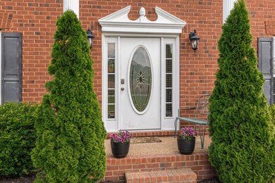 The Covered Front Porch and Traditional Door add a welcoming southern charm.