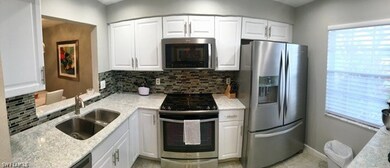 Part of kitchen with pass through to dining area