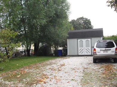 Driveway has plenty of parking and storage shed