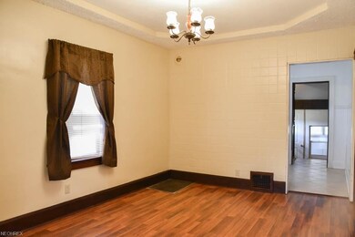 Living room with new laminate flooring and a tray 