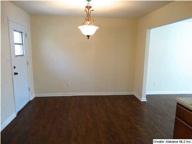 Dining room with updated fixture, hardwood laminat