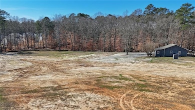 View of yard featuring a view of trees