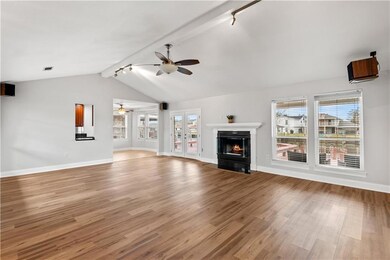 Large open living room with cozy fireplace overloo