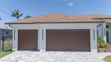 Garage featuring fence