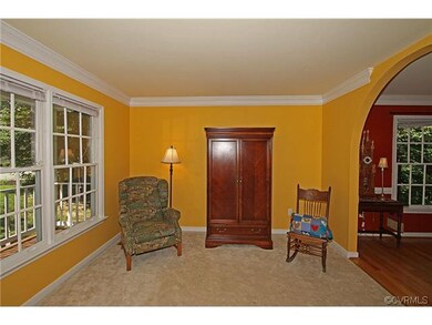 Living Room has arched opening to the dining room.