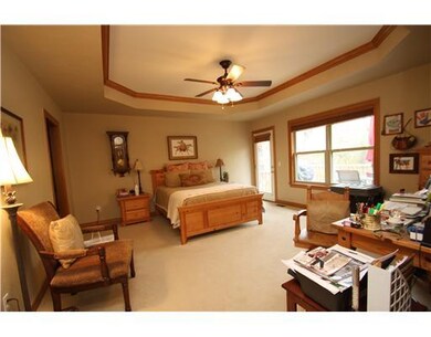 Master Bedroom. A 17 x 15 luxurious master bedroom with tray ceiling and access to back deck and view!