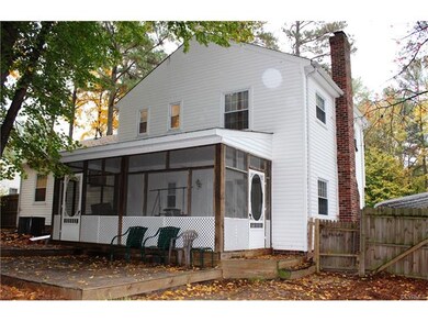 Rear of Home showing Screened-in Porch and deck.