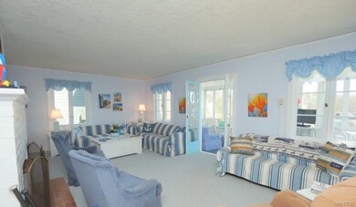 Open and large living room with french doors to en