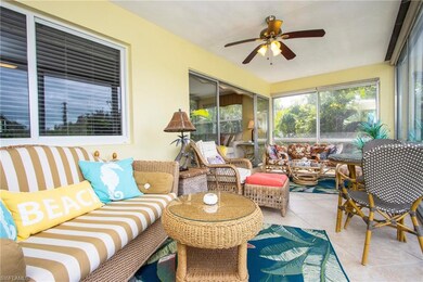 Sunroom / solarium featuring ceiling fan