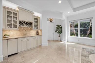 The custom wet bar has an undercabinet Sub-Zero ic