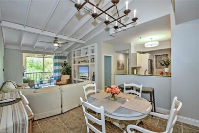 Dining space with vaulted ceiling, built in shelve