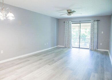 Living Room view with SGD to Screened Porch