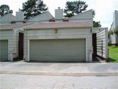 The rear-entry double garage is equipped with an e
