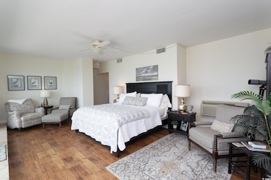 Primary bedroom with wall-to-wall, floor-to-ceilin