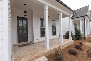 The covered porch adds so much charm and functiona