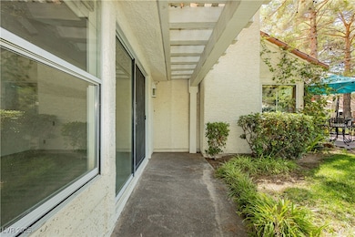Doorway to property featuring stucco siding