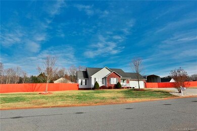 Wow! .52 Acre lot, fenced with RV/carport and an o
