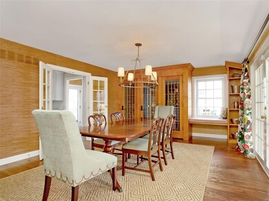Dining room features wine wall and window seat