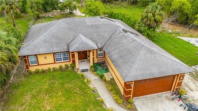 View of front of house featuring a front yard, a s