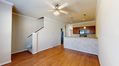 Unfurnished living room featuring light wood-style