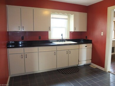 Kitchen with tile floor.