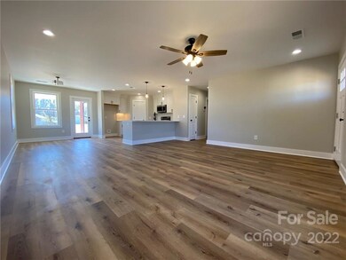 Come on inside. Check out the open floorplan! The large family room will have vinyl plank flooring that will run throughout the house except in some of the bedrooms which will be carpeted.
