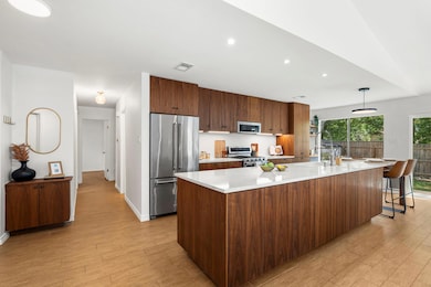 Kitchen featuring high quality appliances, light 