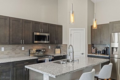 Kitchen featuring a breakfast bar, a sink, a high