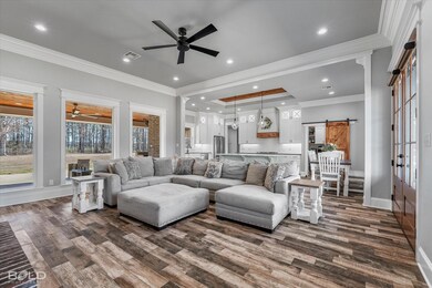 Living room with wood-style tile flooring, ceiling