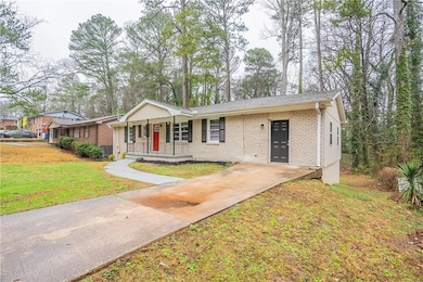Single story home with covered porch and a front l