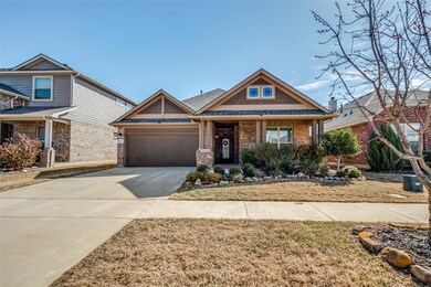 Craftsman-style house featuring brick siding, conc