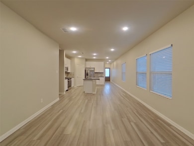 Unfurnished living room with recessed lighting and light wood-style floors