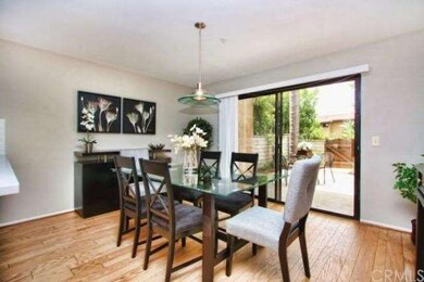 Dining room with real hardwood floors and slider t