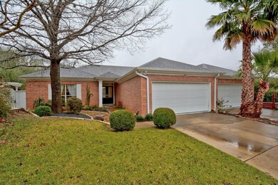 Ranch-style house with brick siding, a garage, co