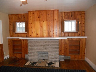 Living room fireplace and book shelves.